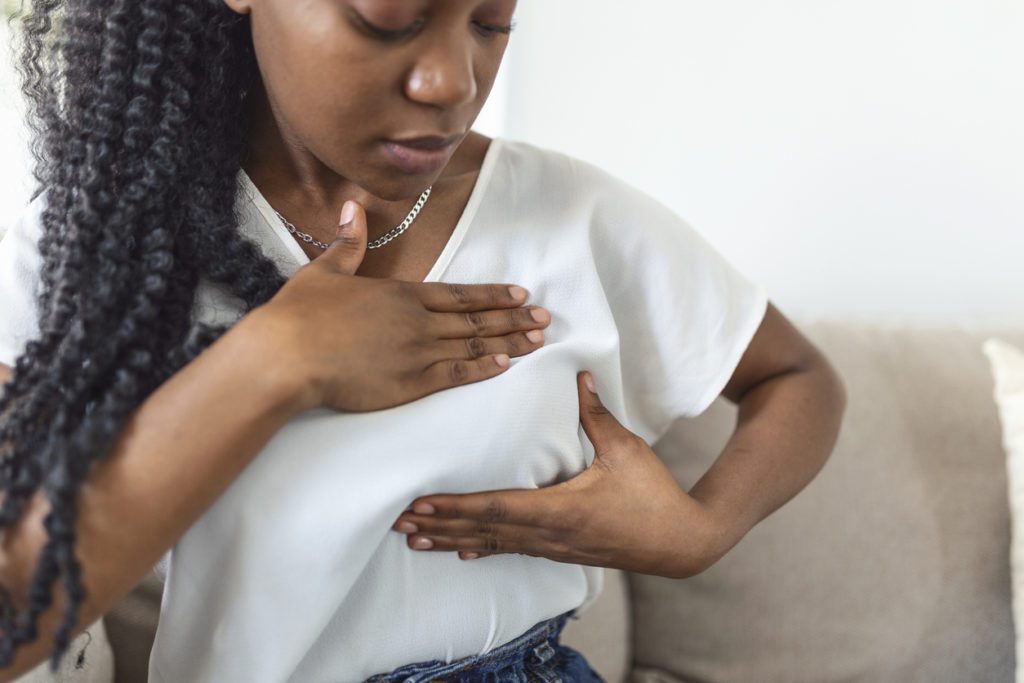 A woman giving performing a self breast exam before her 3D mammogram appointment.