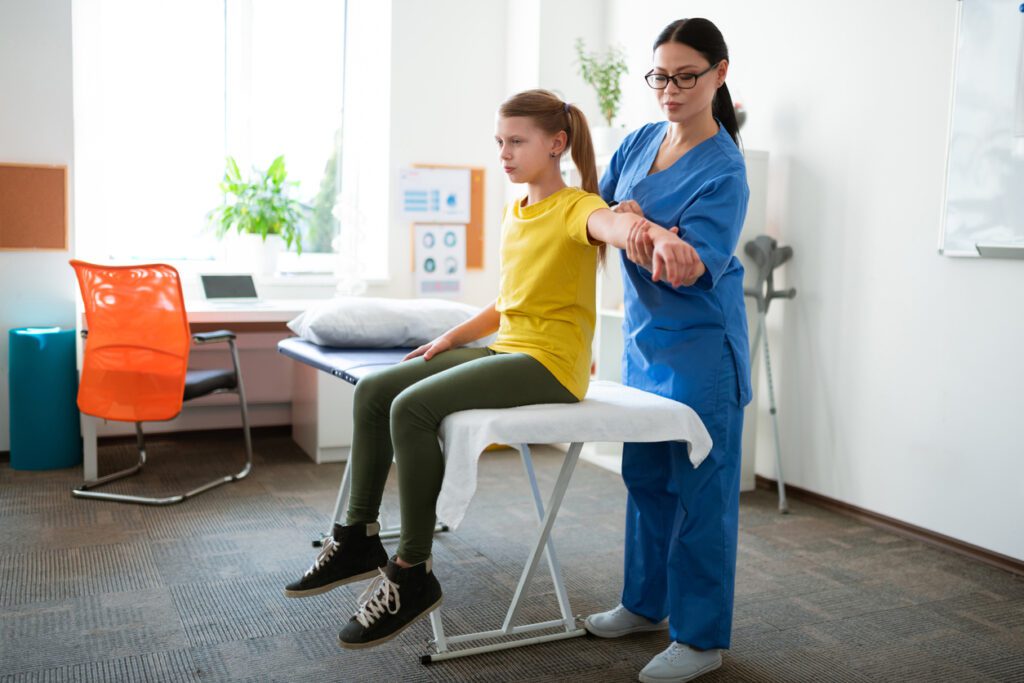 A girl during his sports physical exam