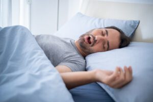 One man falling asleep and snoring in bed