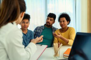 African American boy being examined by the female pediatrician