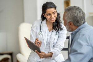primary care doctor with senior Patient