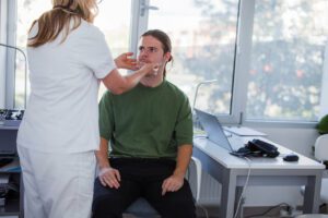 Checking thyroid glands at the primary care doctor